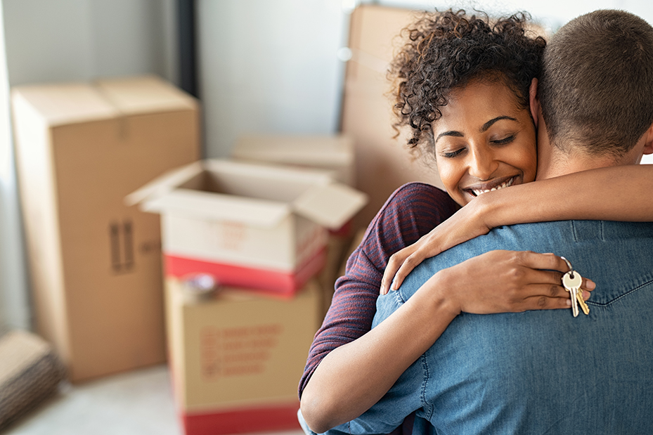man-and-woman moving into home