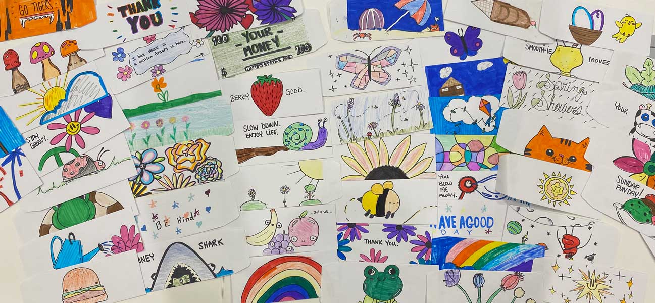 teller envelopes decorated by local kids